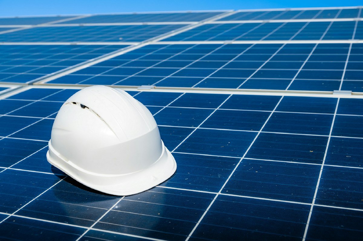 Safety helmet resting on a solar panel at the site